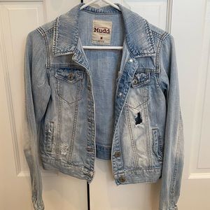 Denim jacket with rips